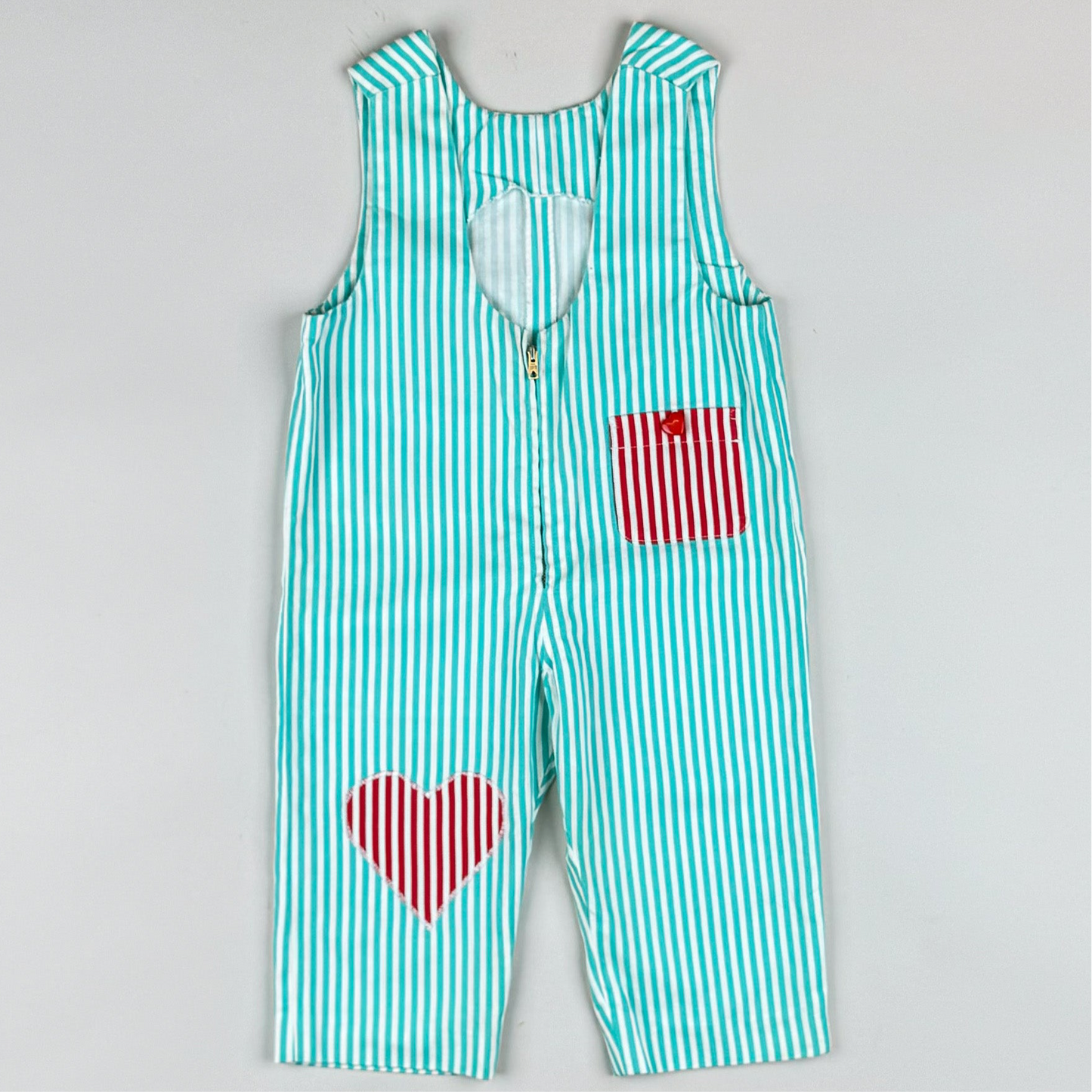 Overalls in turquoise and red