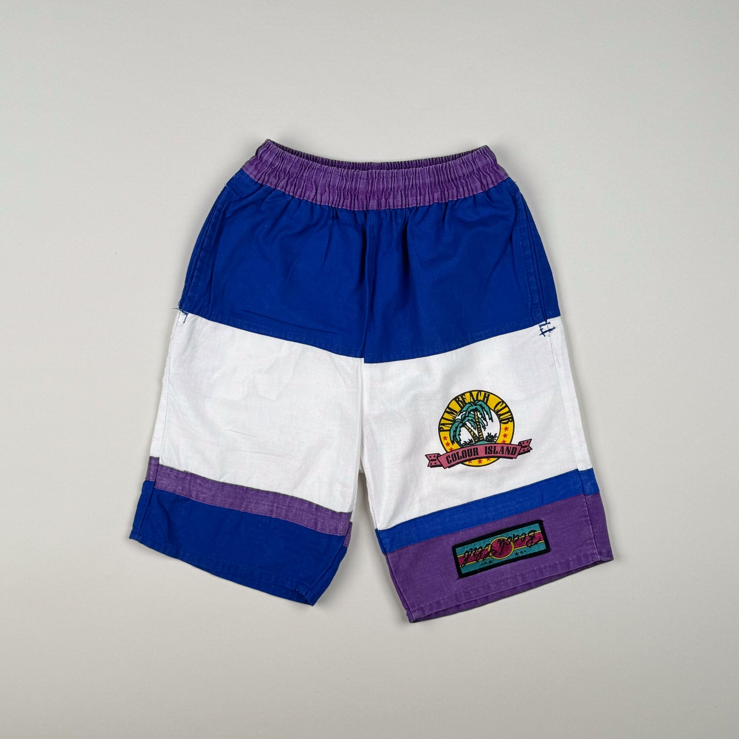 Short in blue, white and purple