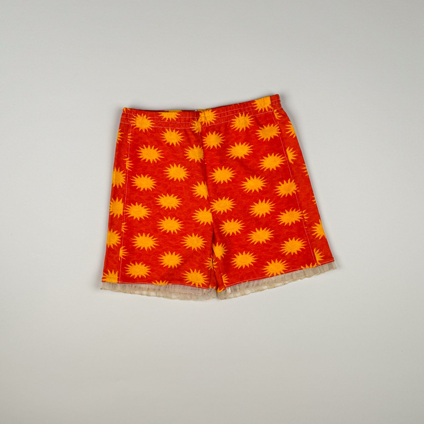 Short in red, orange and white