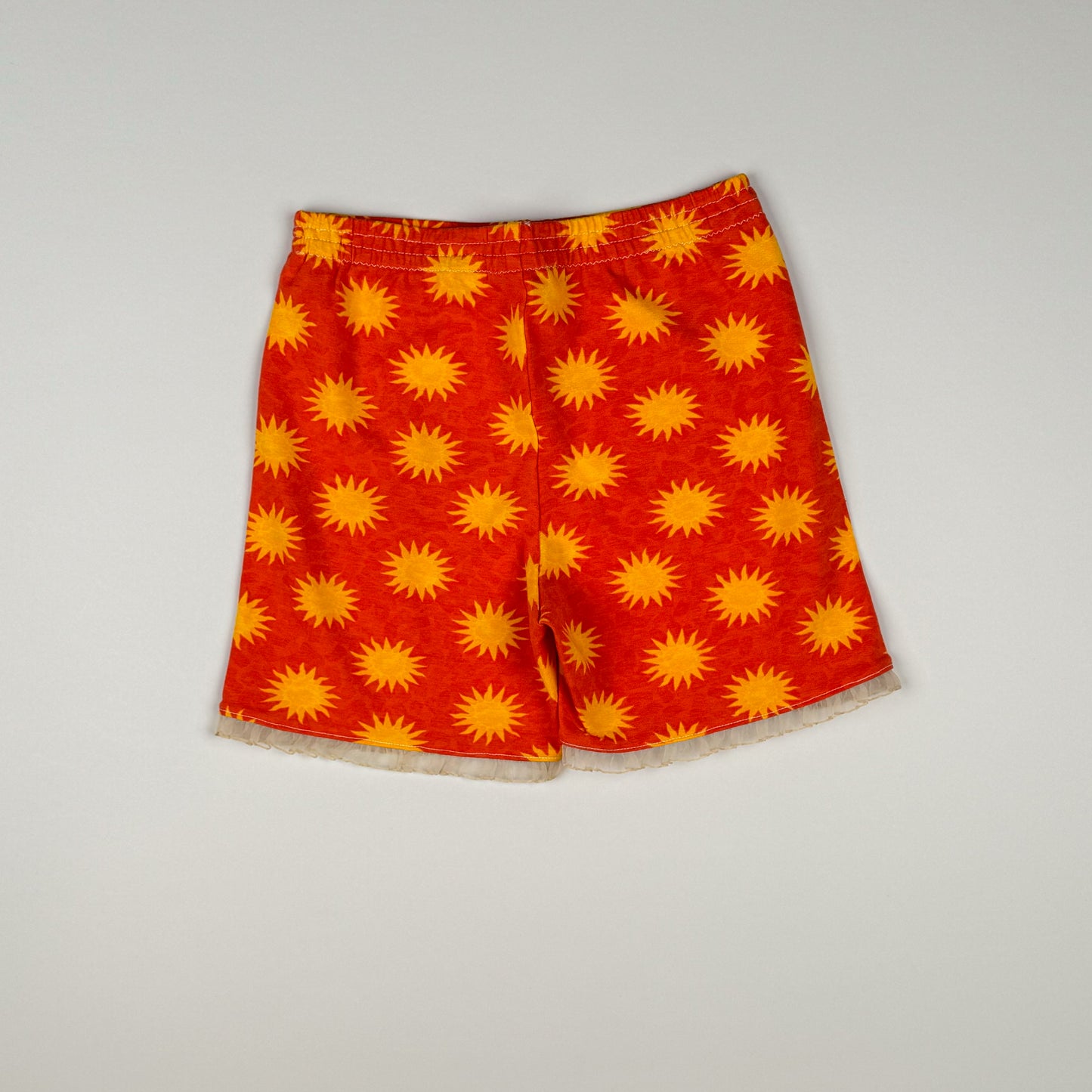 Short in red, orange and white