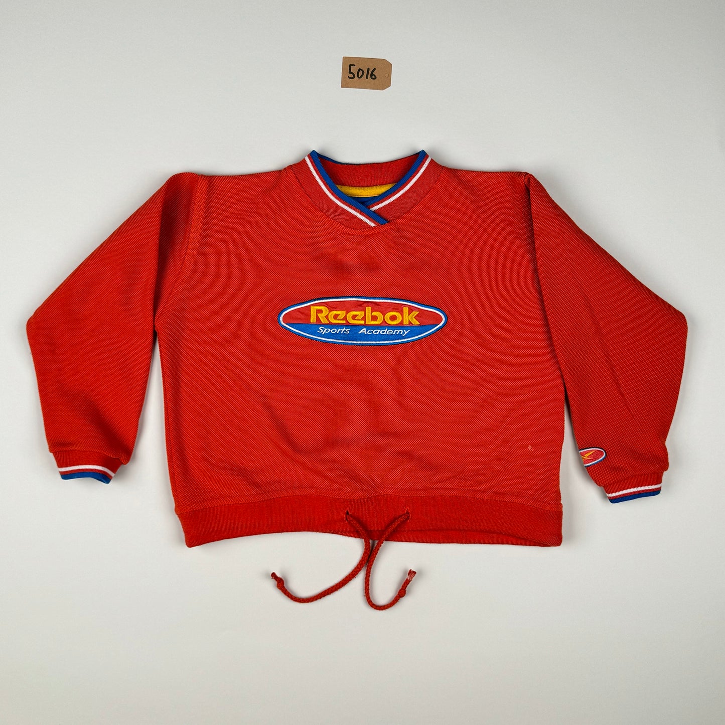 Sweatshirt in orange, red and blue