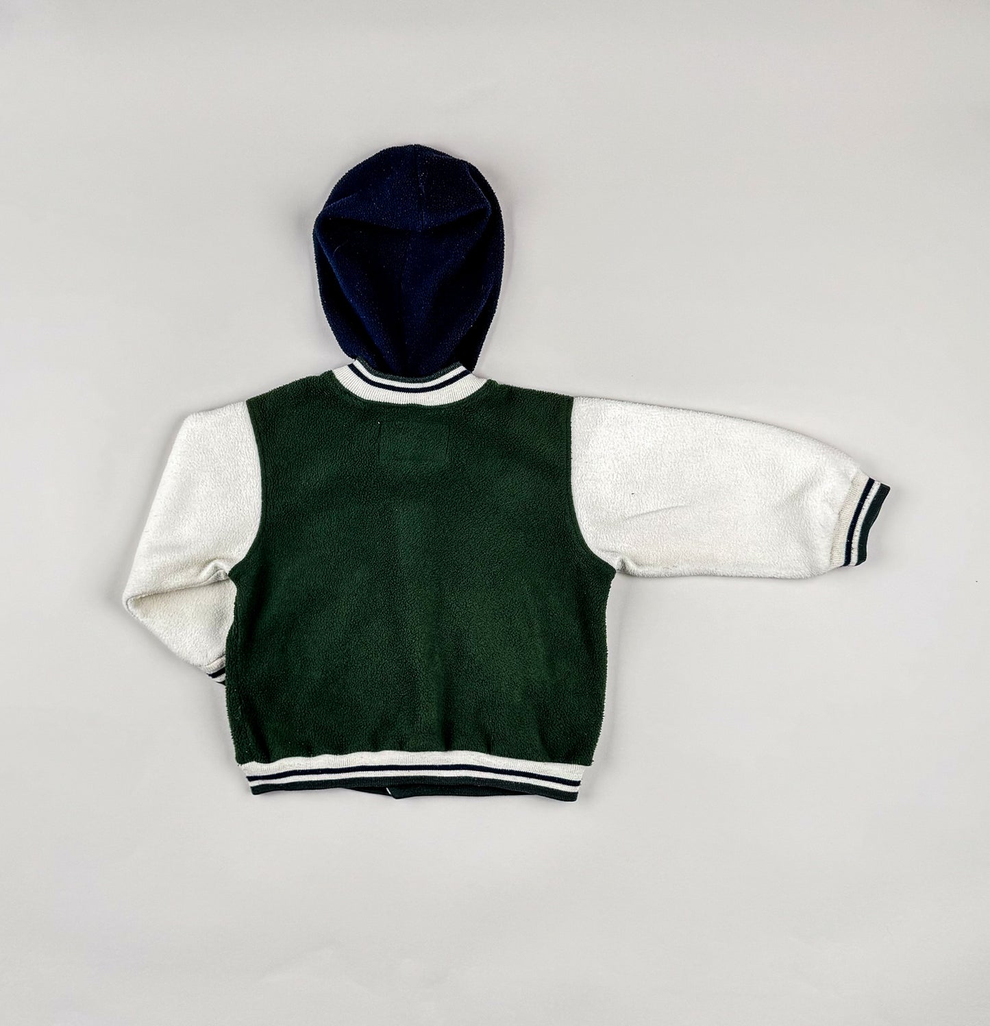 Fleece jackets in green, white, blue