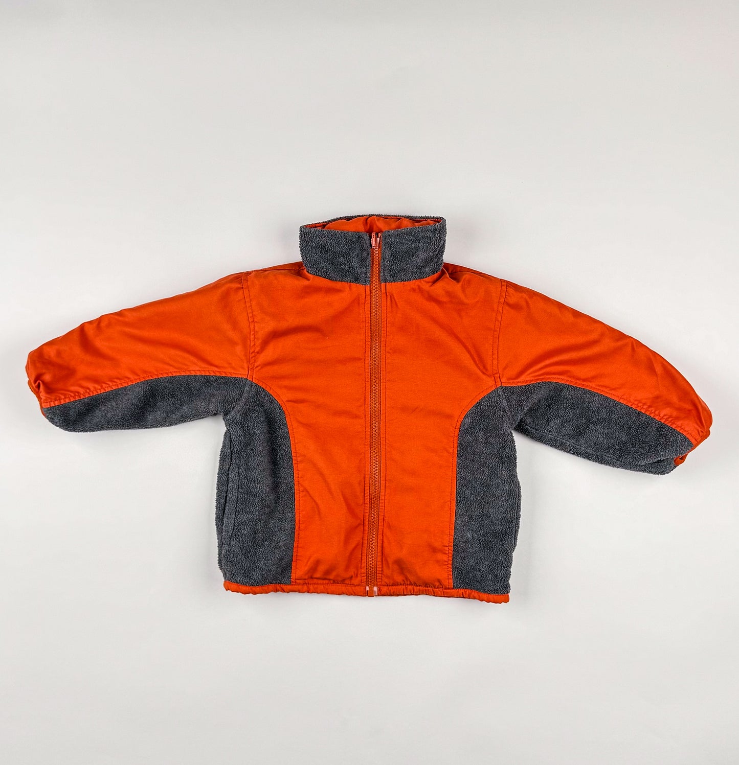 Fleece jackets in grey, orange