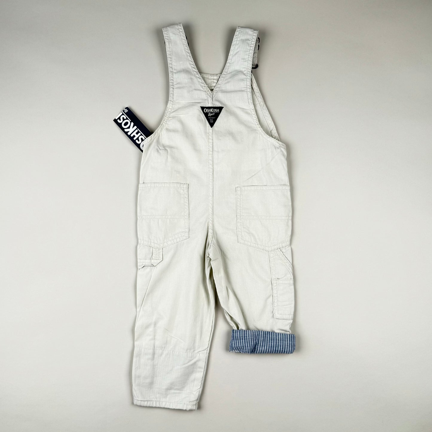 Overall in beige, blue and white