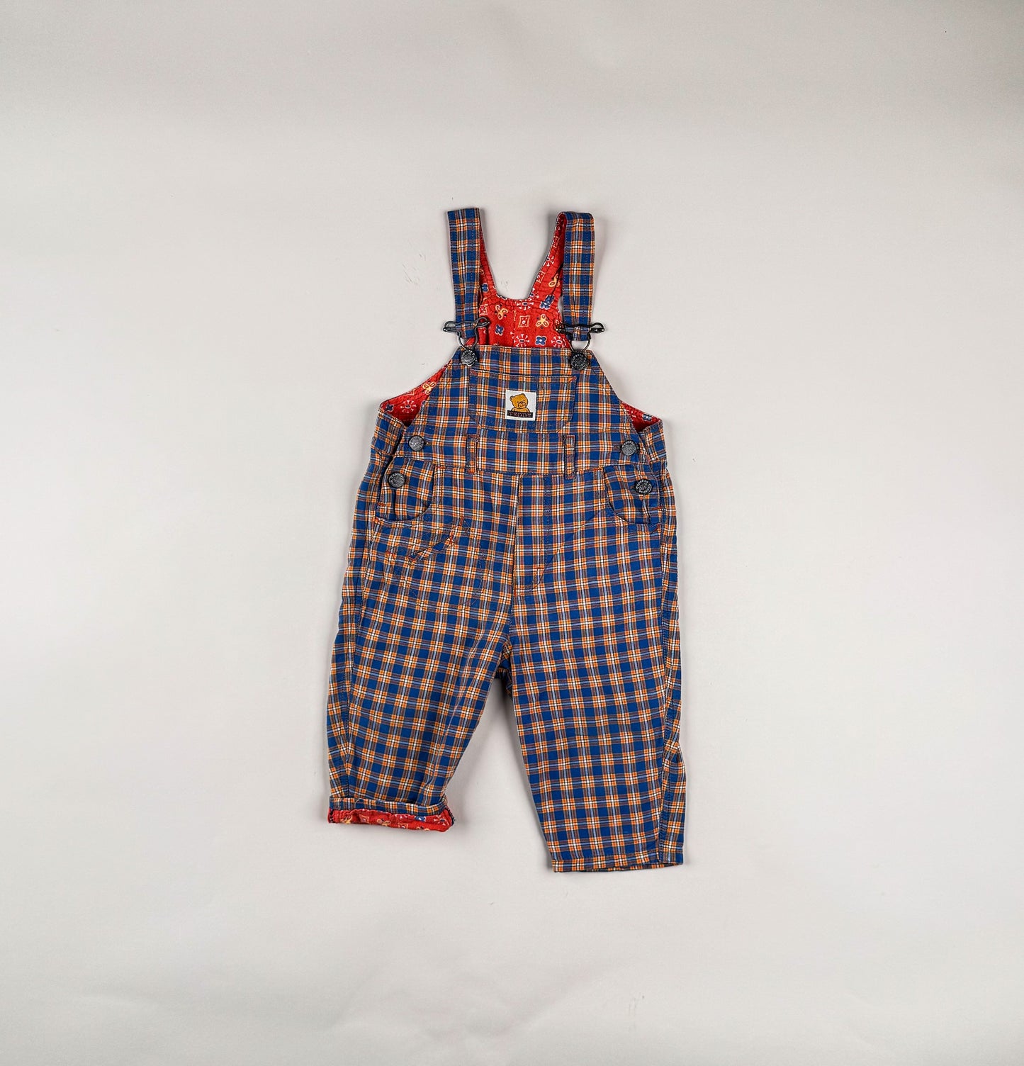 Overalls in blue, orange and white