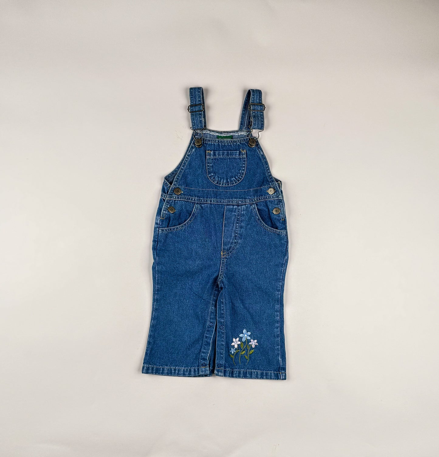 Overalls in blue, pink and green