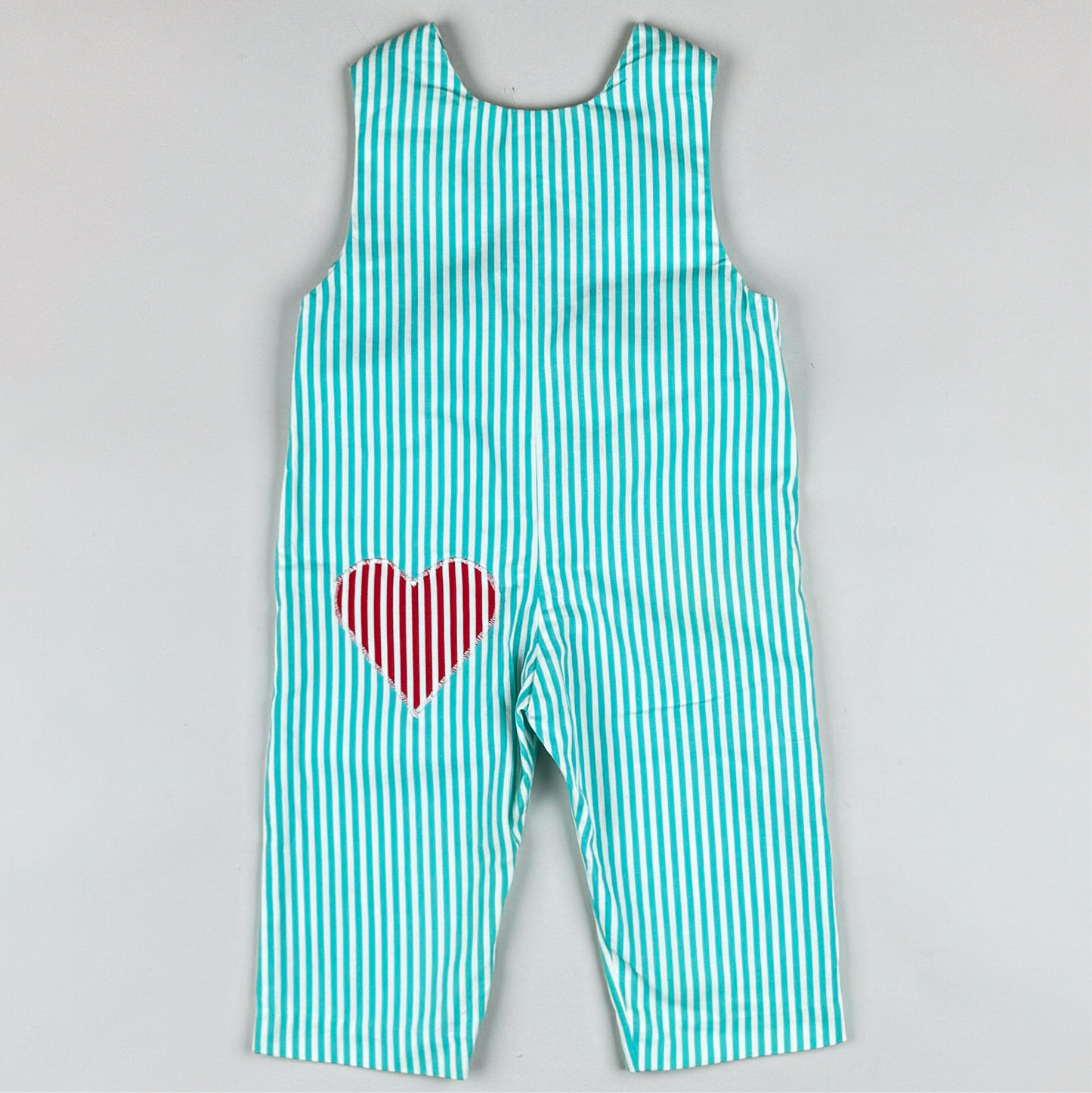 Overalls in turquoise and red