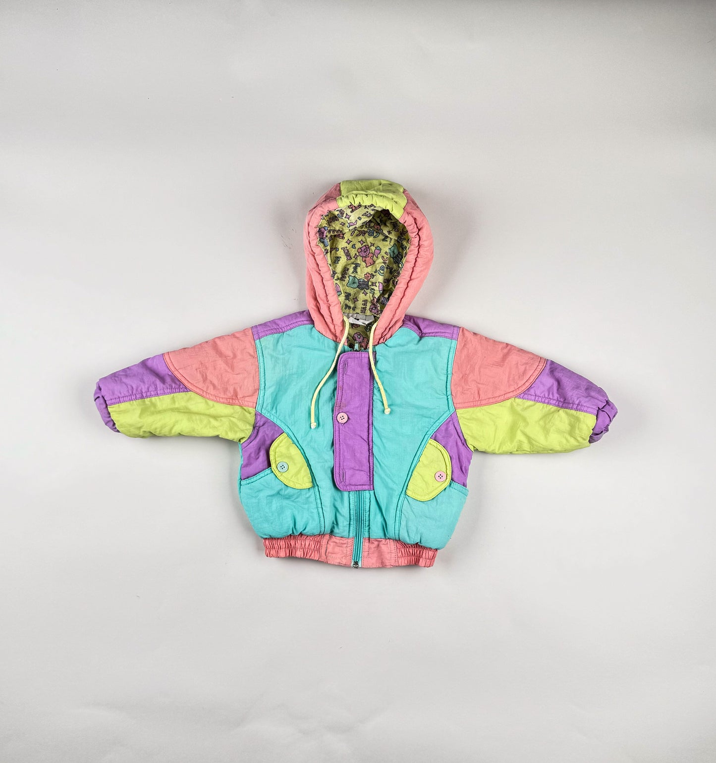 Padded Jacket in blue, yellow, peach and purple